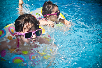 Children playing in the pool.